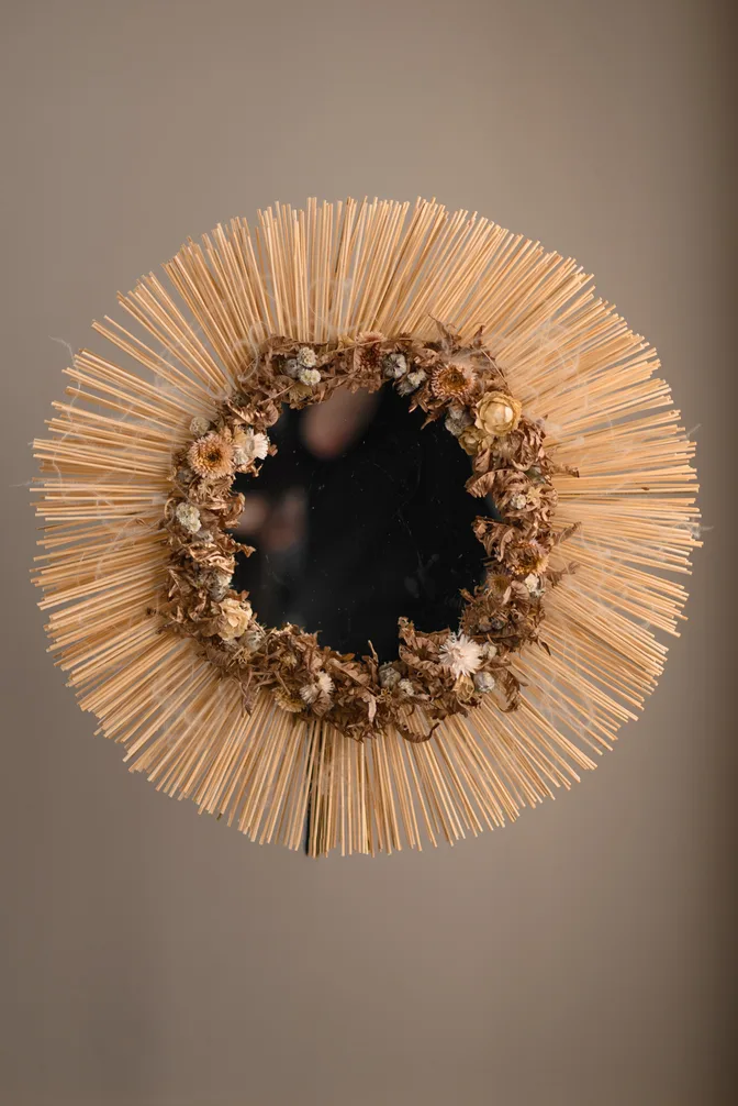 Mirror decorated with dried flowers