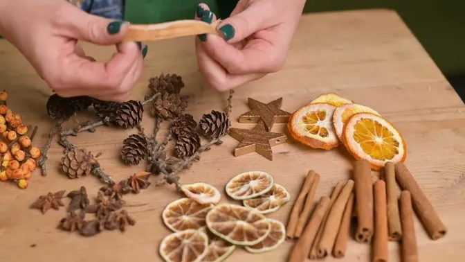 Dried citrus slices, cinnamon, larch cones, star anise and wooden stars