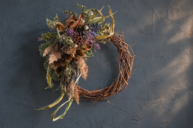 A vine wreath with an abundant dried-flower accent