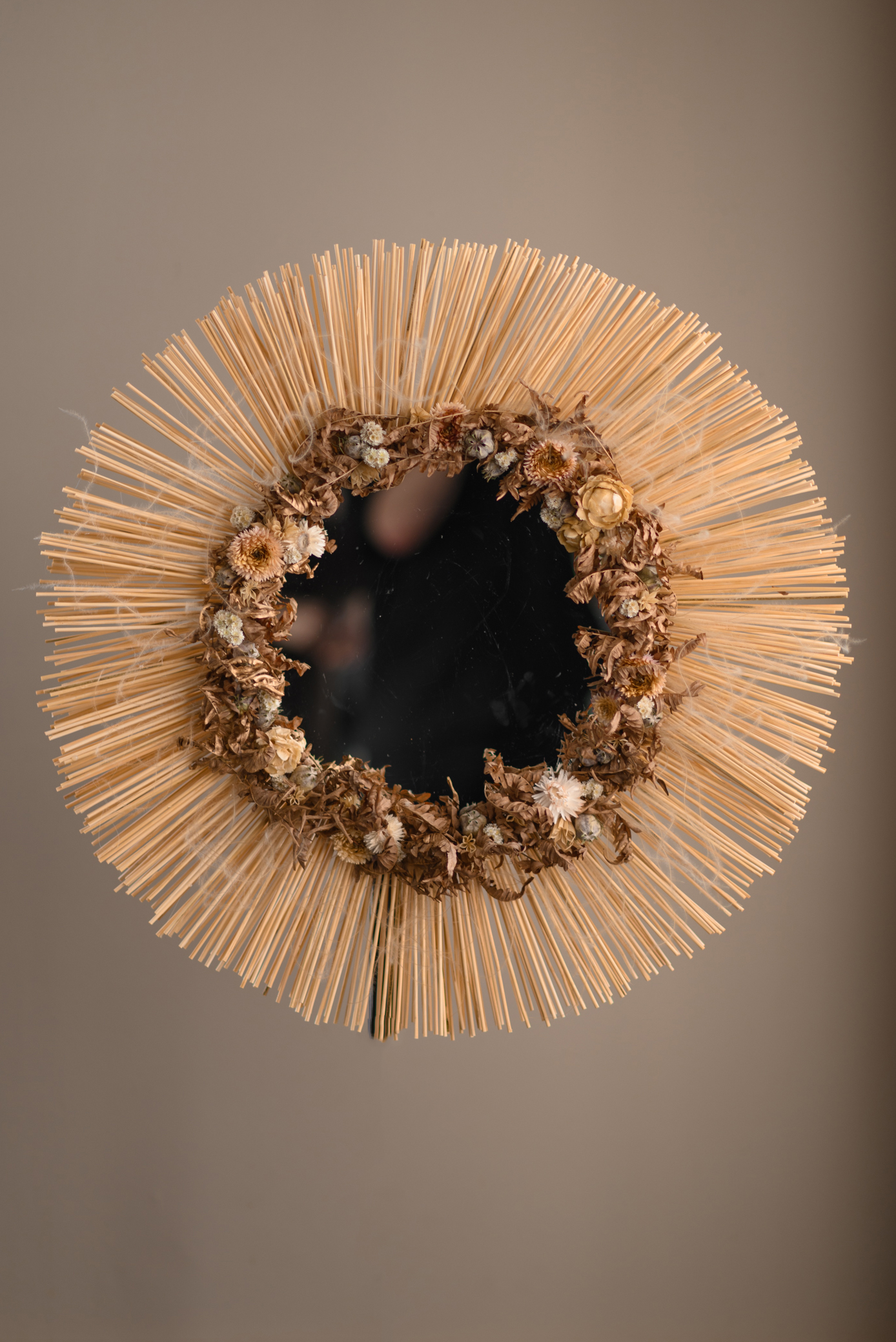 Mirror decorated with dried flowers