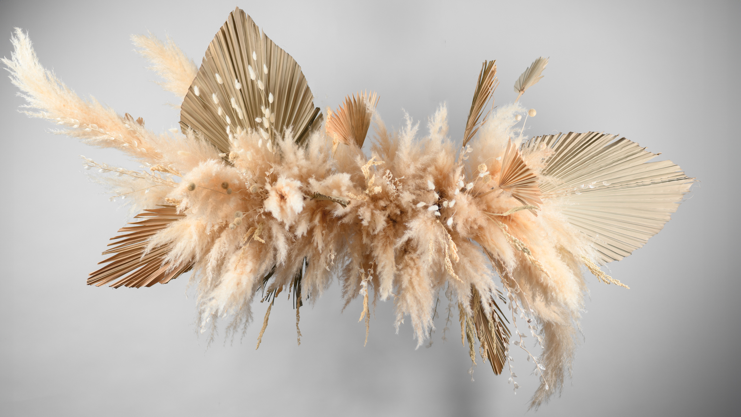 Large hanging dried flower installation in an interior